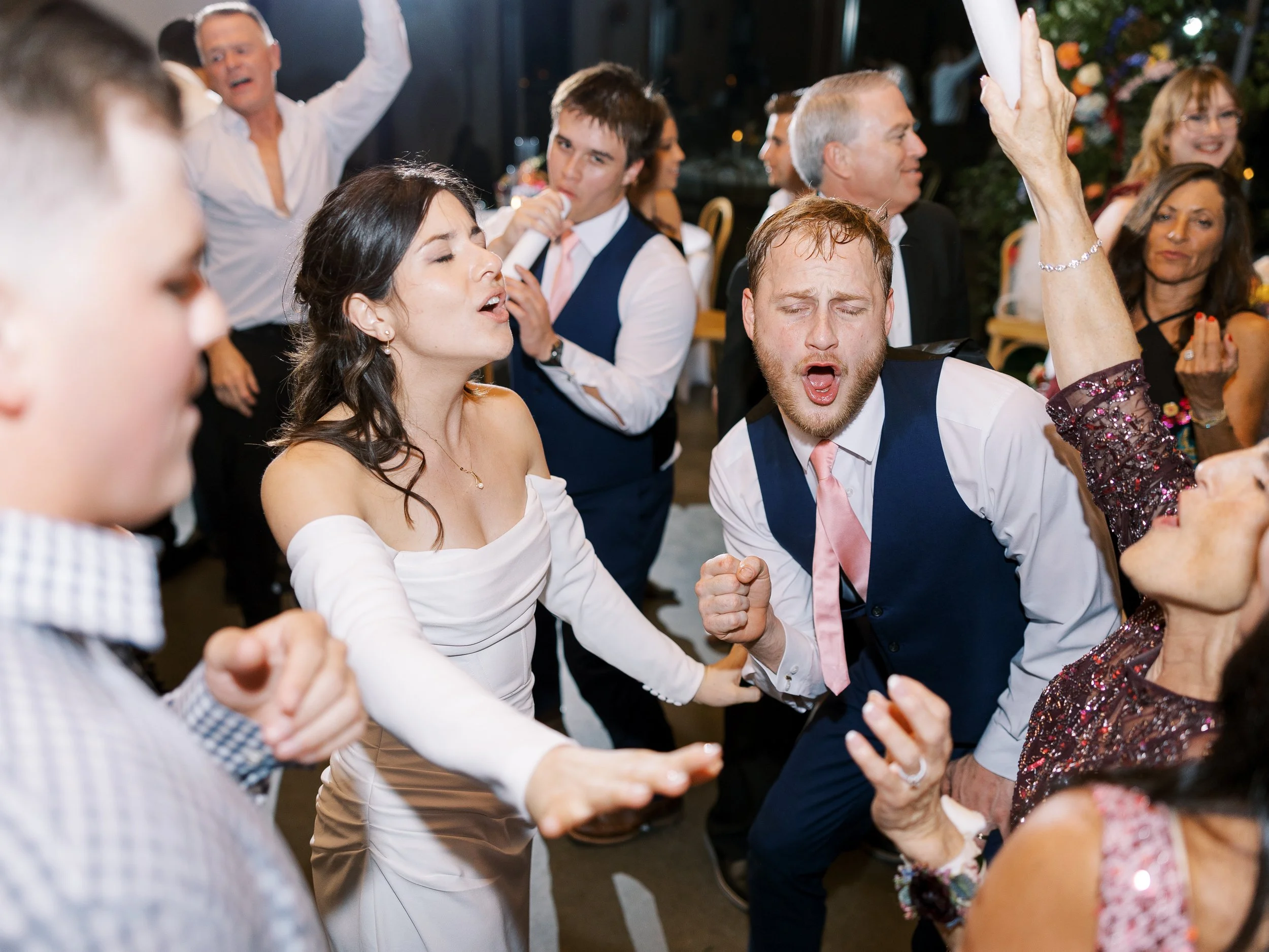 Wedding guests dancing together
