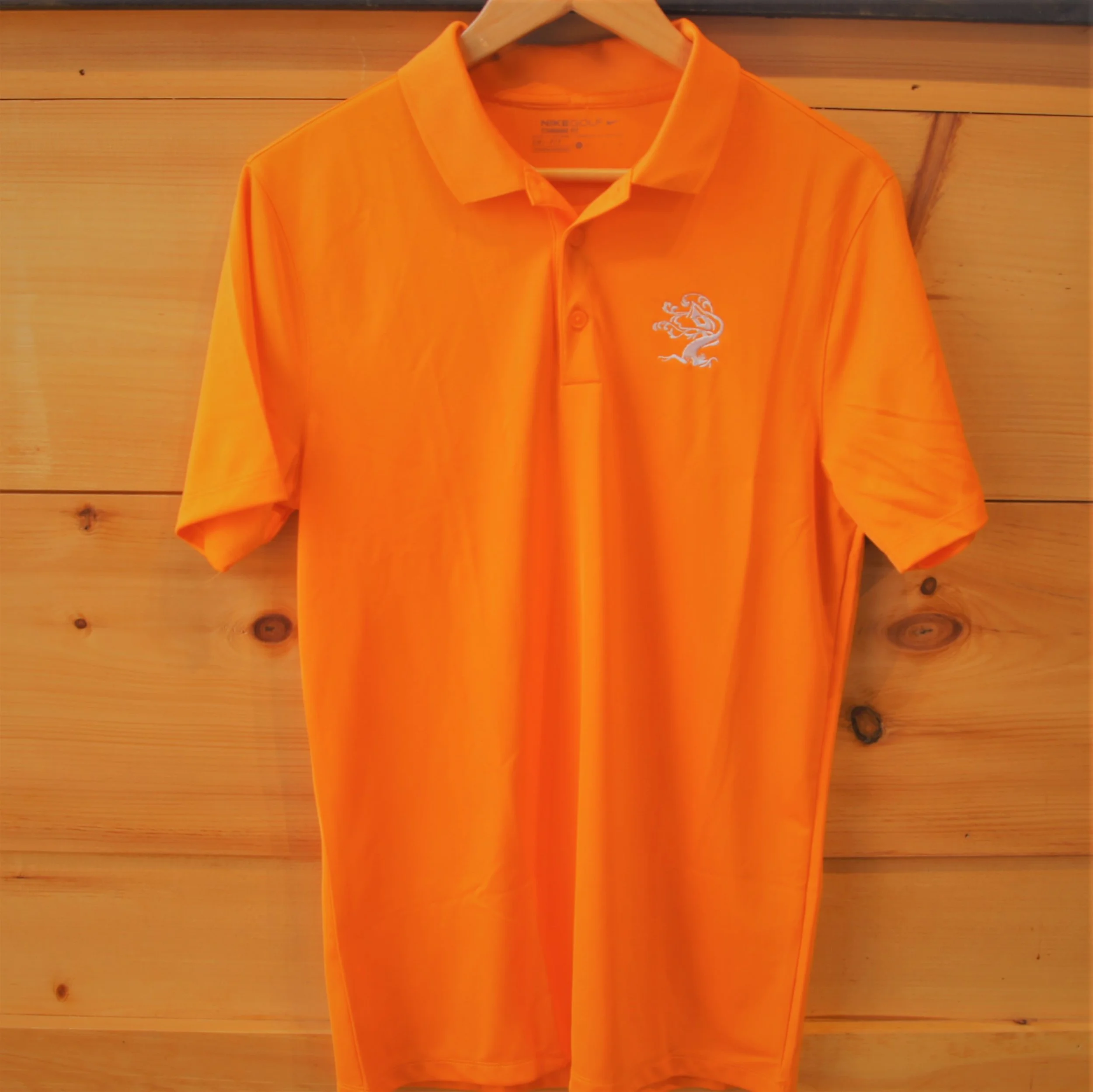 orange nike golf shirt