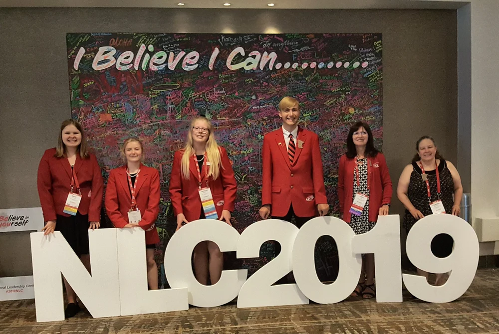 The FCCLA National Leadership Conference 2019 theme is displayed in the background and attending from Wadena-Deer Creek High School, from left: WDC FCCLA members Casey Bounds, Angela LeComte, Morgan Grangruth, and Elliot Doyle, and co-advisors Cindi Koll and LaDonna Norenberg. Courtesy photo.