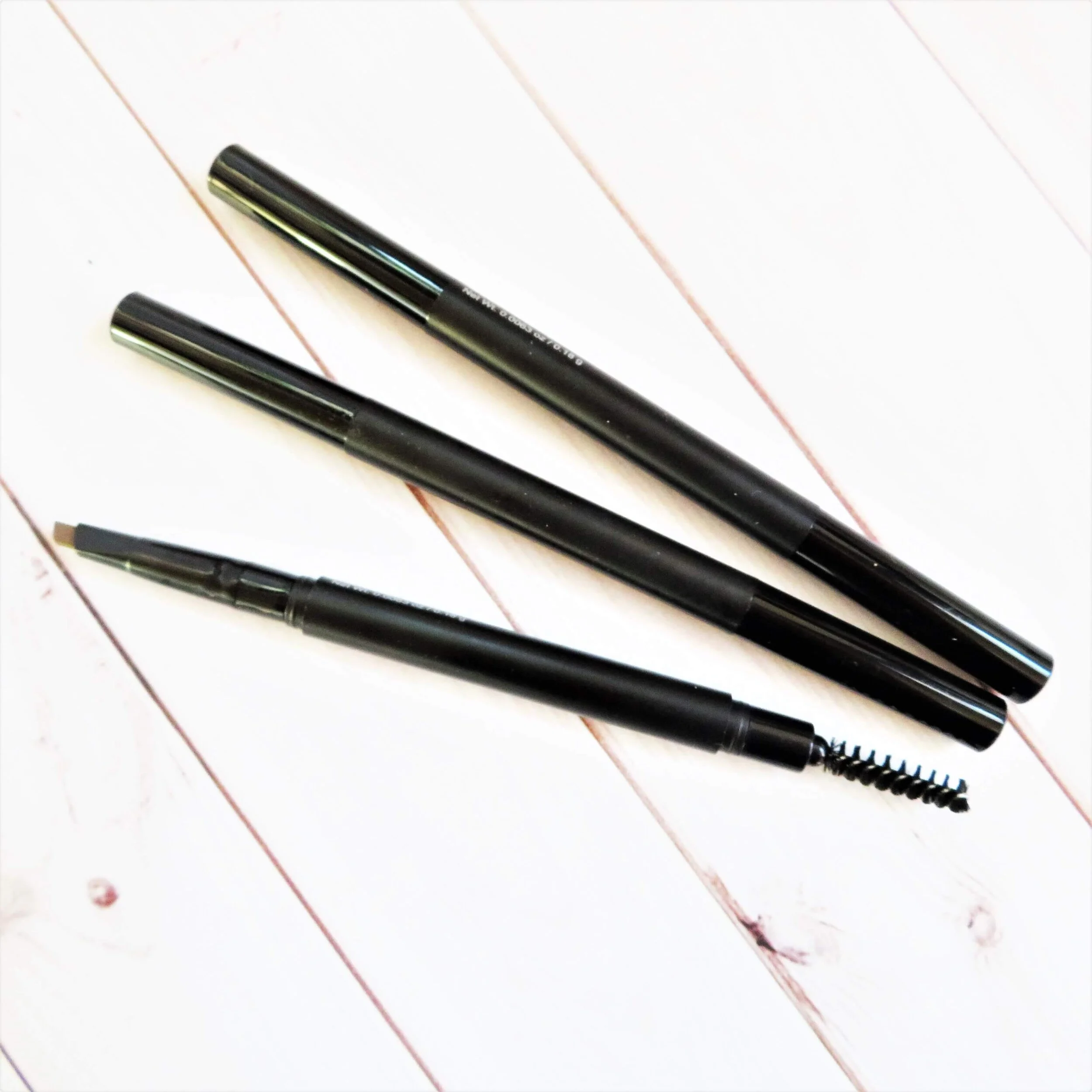 retractable eyebrow brush