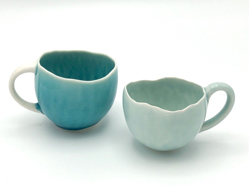 intricate black/white design with teal... Mystic Teal Stoneware Mug by Ladelle 