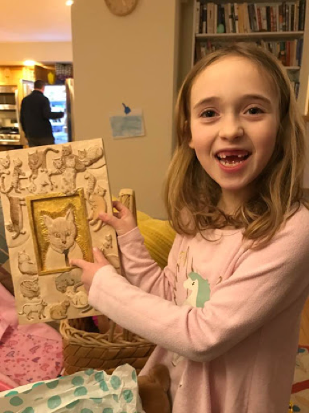 Where It Lives. Martha's beautiful and whimsical cat carving was excitedly received by her niece. That smile says it all.