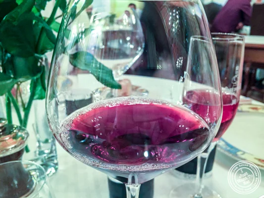 Glass of Volnay Clos Des Ducs at at L'Auberge du Pont de Condongesof Paul Bocuse in France
