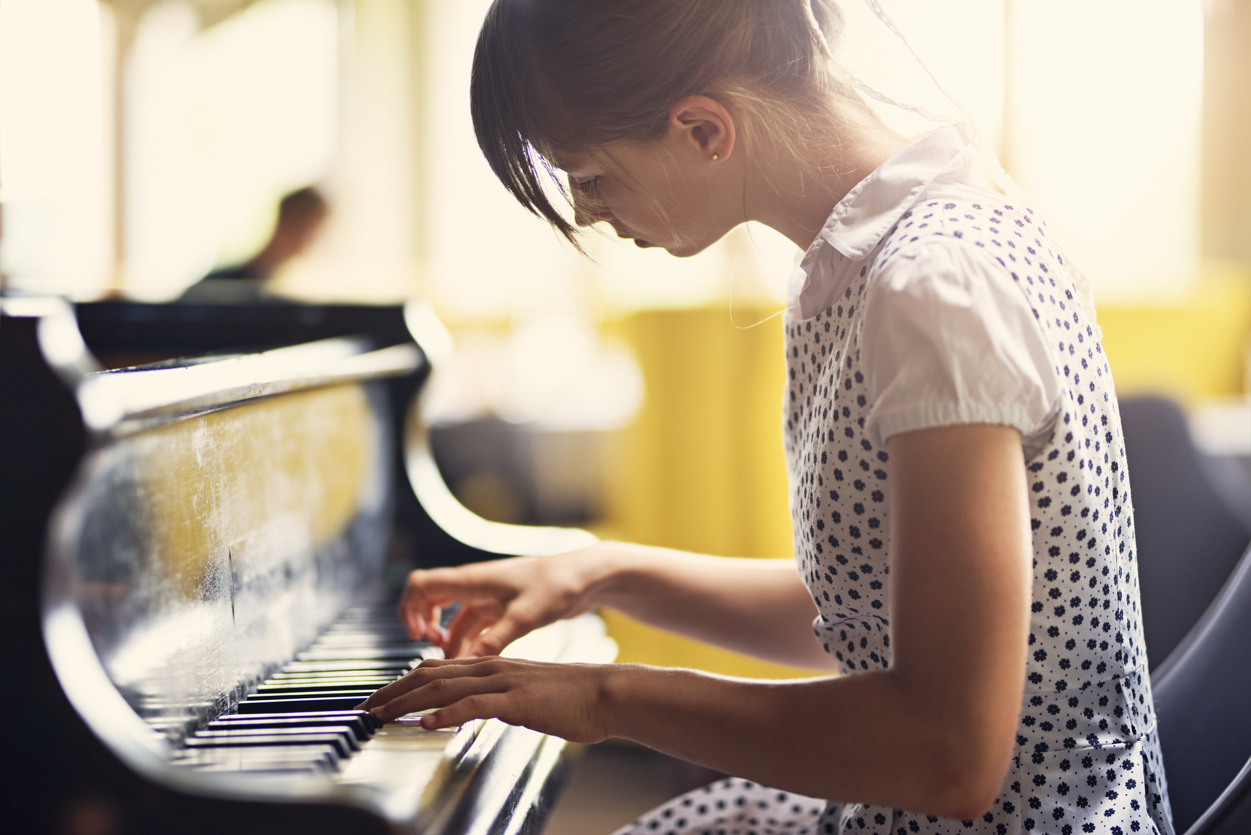 Teen Girl Playing Piano