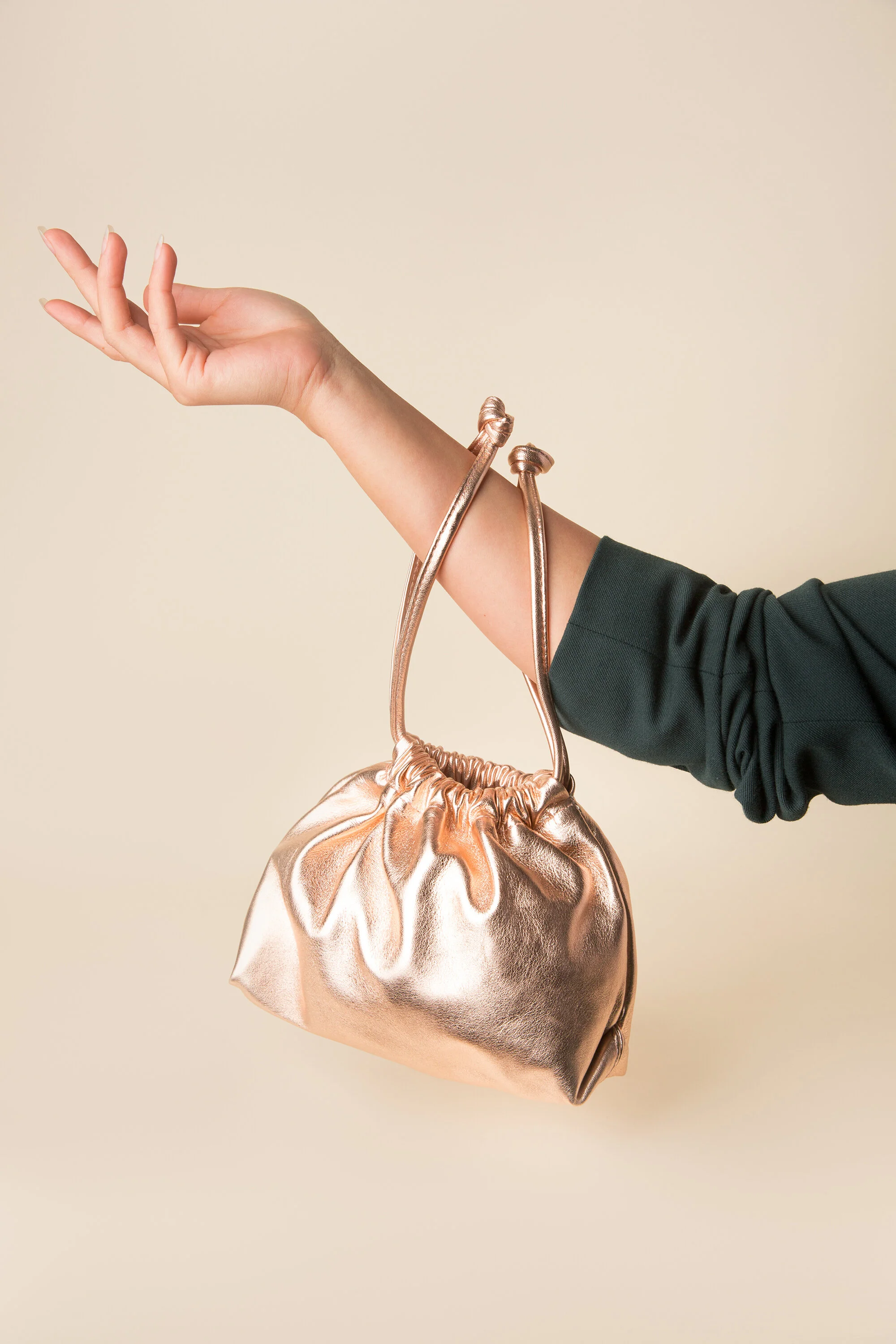 rose gold wrist bag