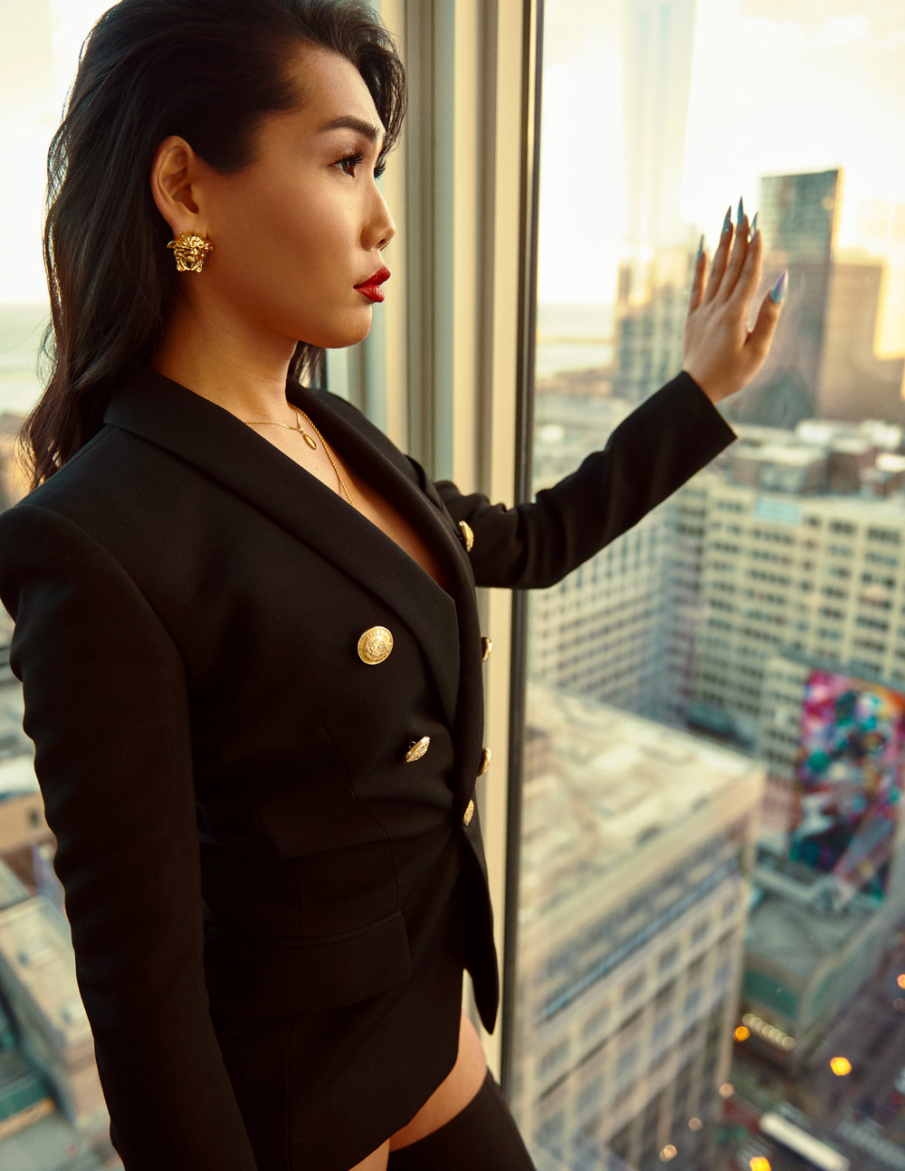 Blazer: Balmain, Jewelry: Versace