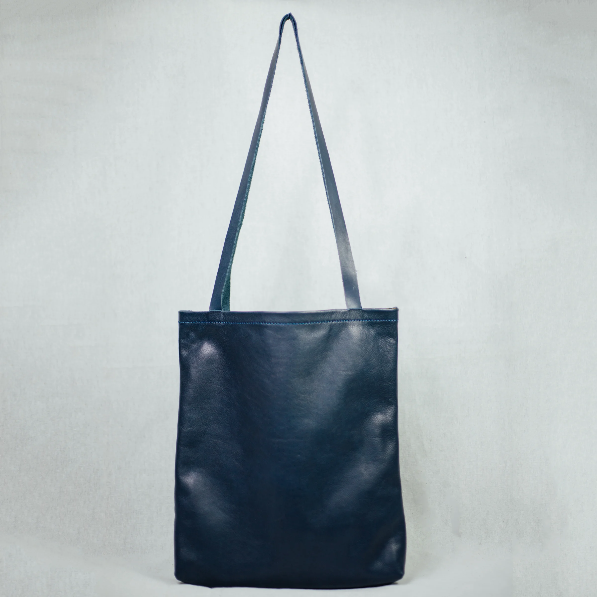navy blue leather tote bag