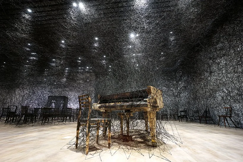 in silence | 2002/2019 | burnt piano, burnt chair, alcantara black thread | dimensions variable, production support: alcantara s.p.a. | courtesy: kenji taki gallery, nagoya/tokyo. photo by sunhi mang, courtesy of mori art museum, tokyo