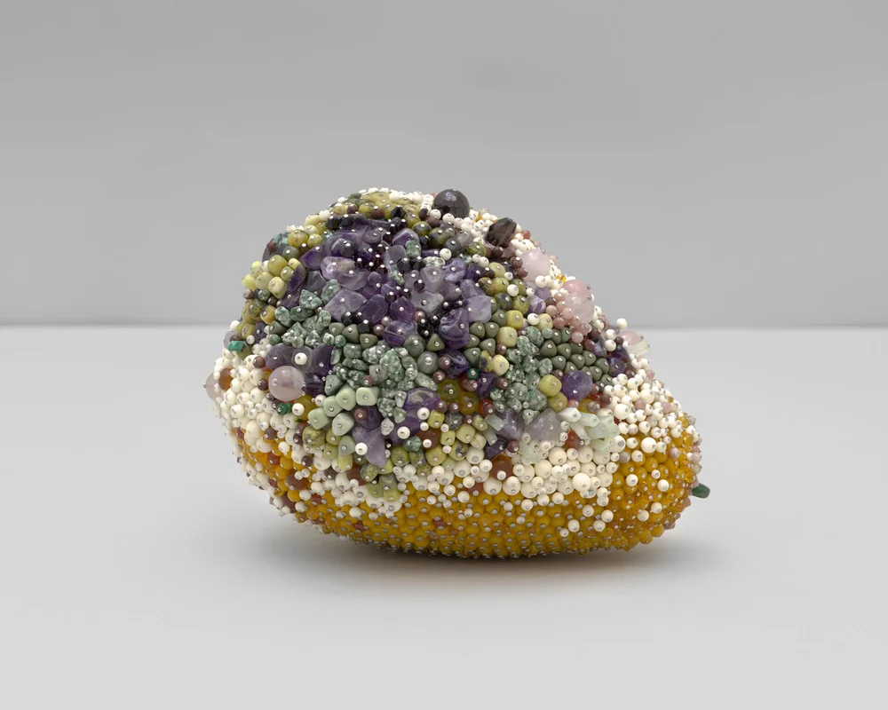 “Soft Spot” (2019), amber, amethyst, rhodonite, rose quartz, serpentine, tree agate, jungle jasper, smokey quartz, garnet, agate, turquoise, olive jade, bone, pink lepidonite, glass, steel pins on coated polystyrene, 6 x 8 x 6 inch