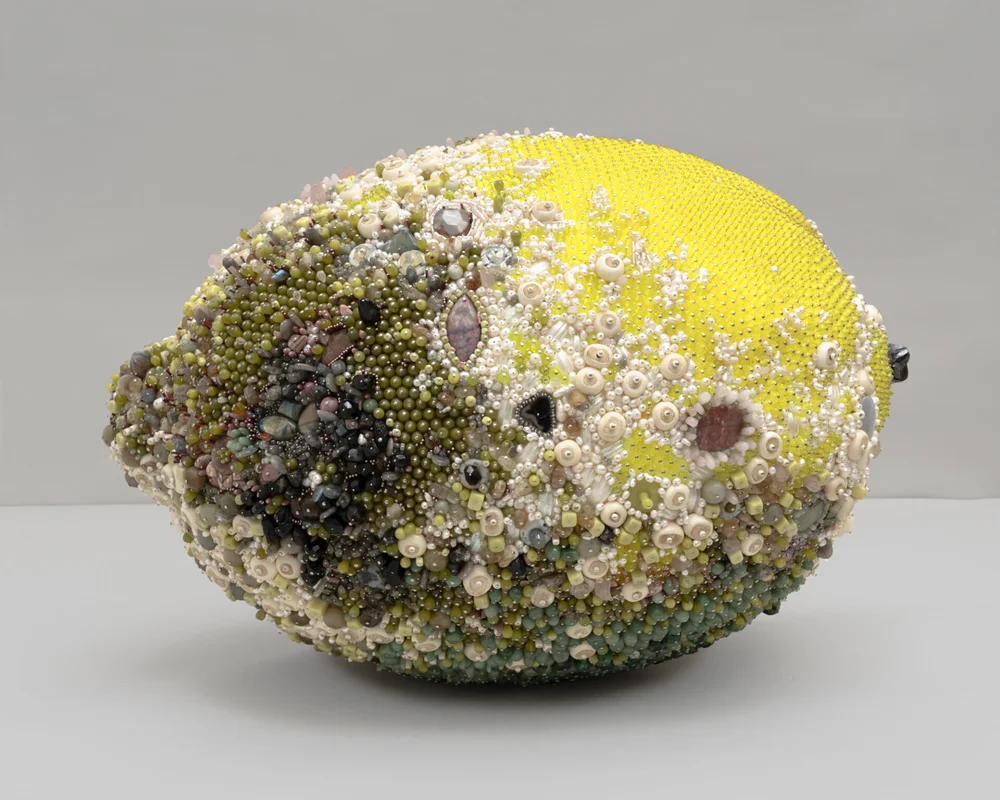 “Bad Lemon (Sour Sparkle)” (2019), serpentine, aventurine, labradorite, rhodonite, rhodochrosite, pink aventurine, rose quartz, black onyx, citrine, unakite, tektite, smoky quartz, quartz, carnelian, limestone, pink lepidolite, tree agate, red agate, grey agate, black agate, breccicated jasper, hematite, mother of pearl, bone, freshwater pearl, 19 3/4 x 20 x 29 inches