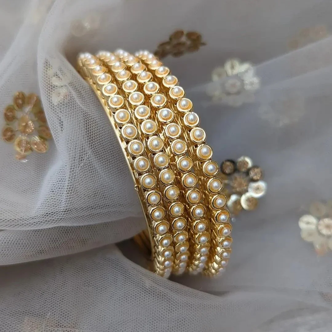 Real on sale pearl bangles