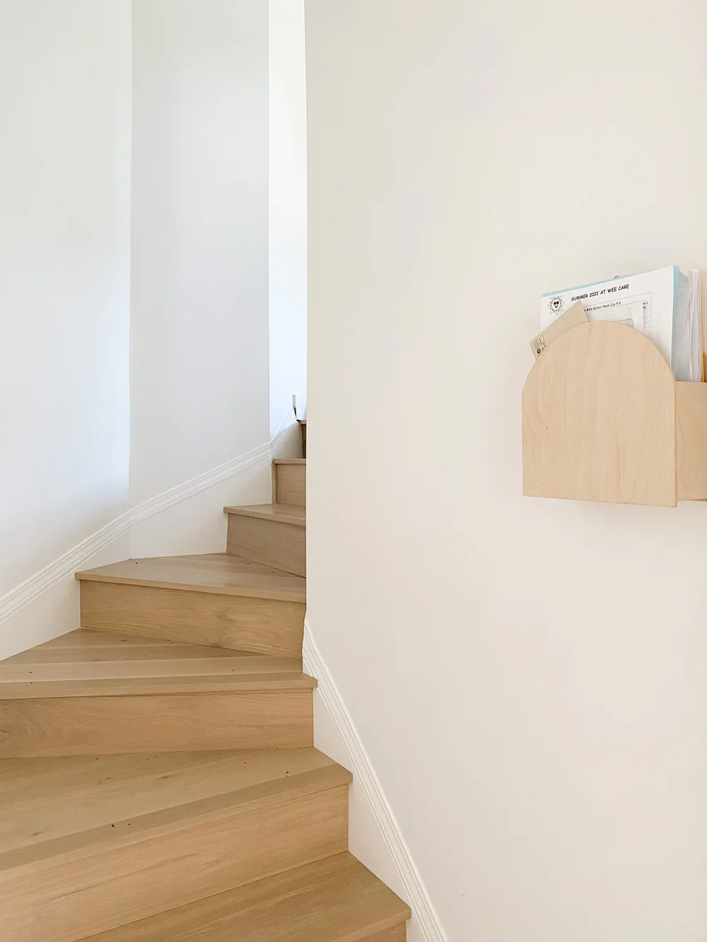 Our newly recovered stairs in white oak engineered hardwood. Something Small Mail Holder .