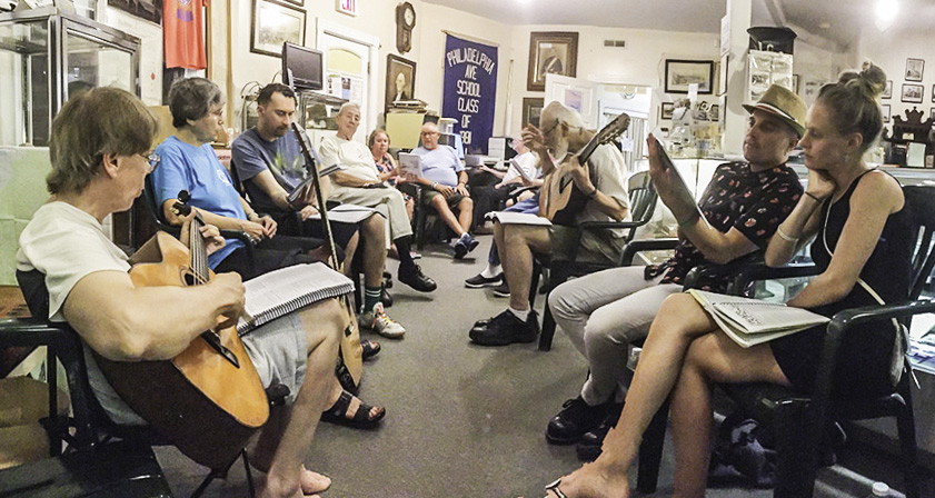 Musicians lead a sing-along of peace songs