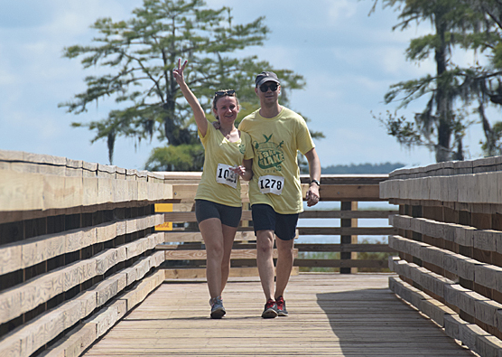 Over 150 walk/run participants completed the Lake Waccamaw State Park section of the 16-mile route over the new pedestrian bridge at the dam.