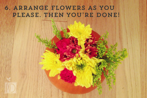 Once the flowers are arranged as you please, your pumpkin is complete.