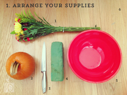 Arrange your supplies – 1) flowers, 2) pumpkin, 3) knife, 4) flower sponge, 5) bowl of water, and 6) cutting board.