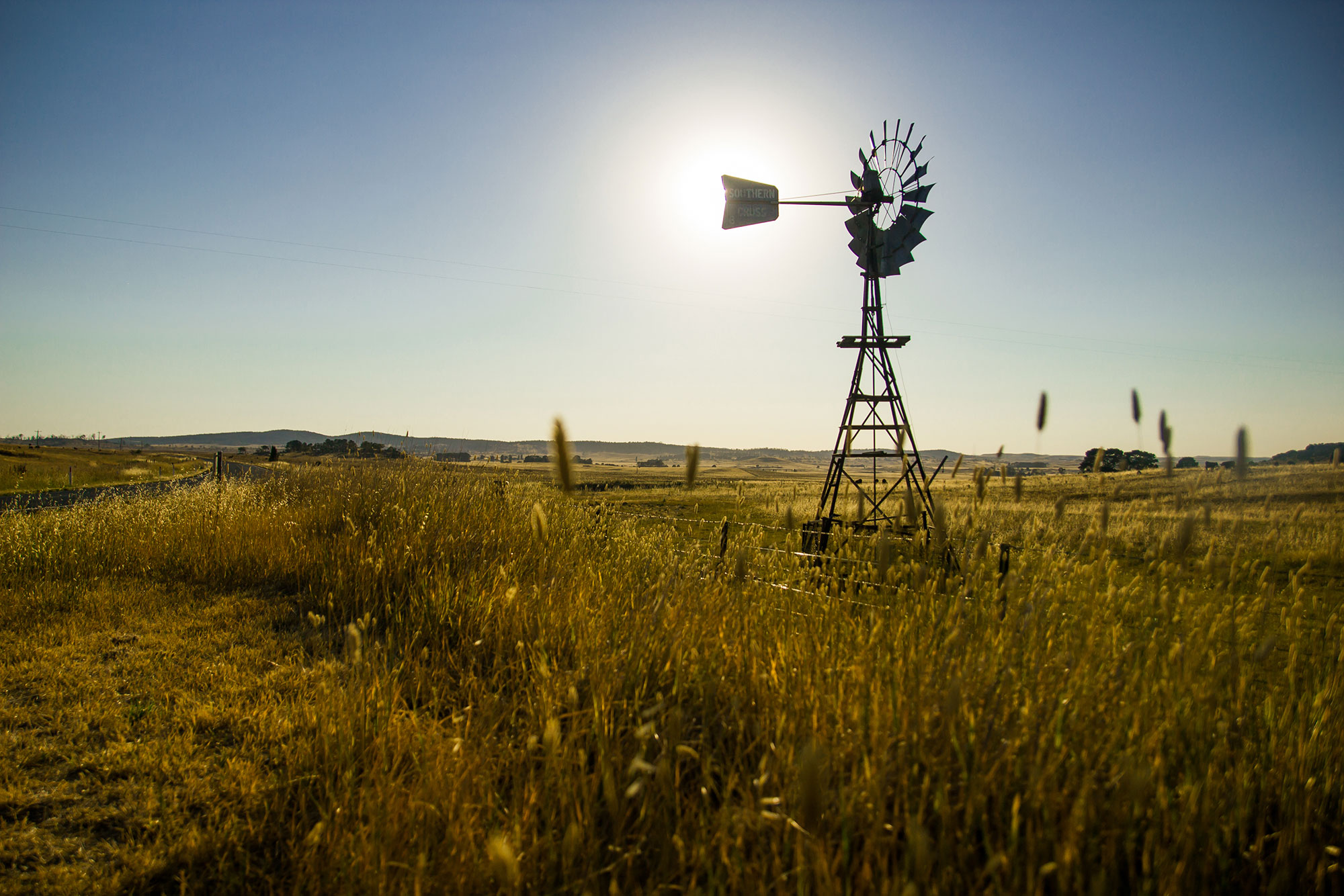 bigstock-Windmill-Silouhetted-In-Rural--81626480.jpg