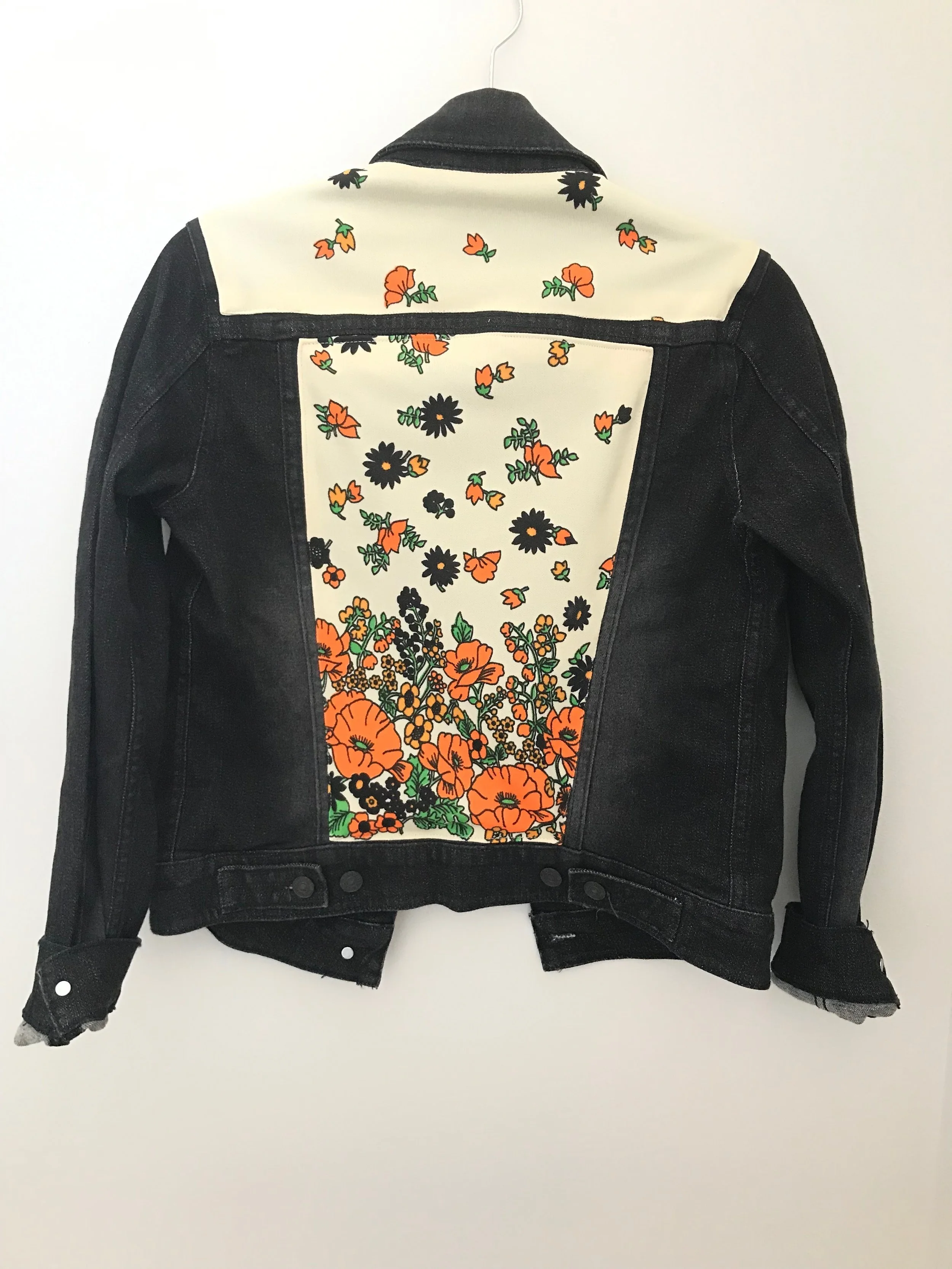 black jean jacket with designs