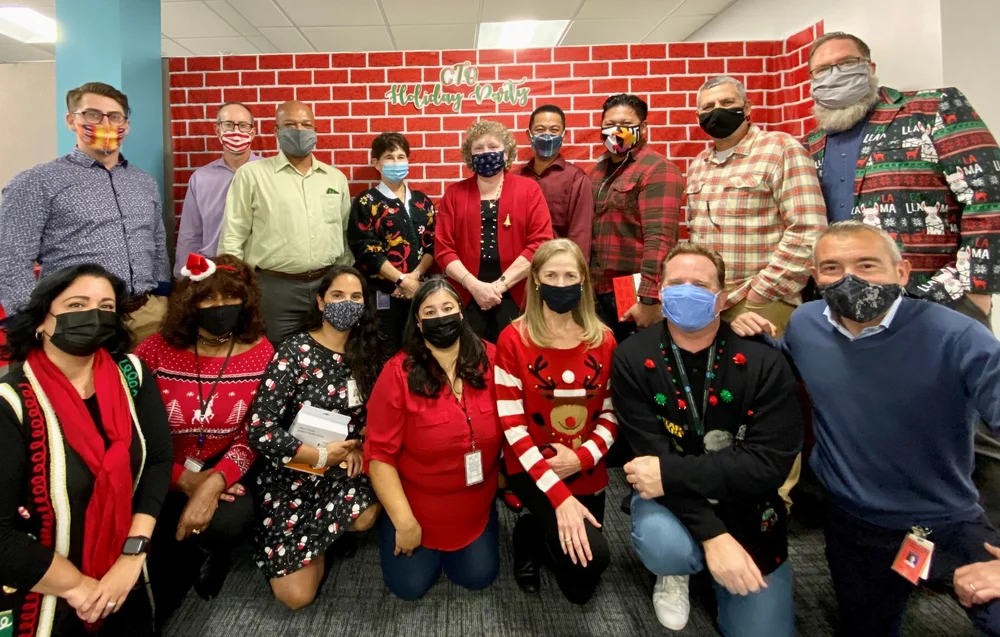 CTO crew wearing holiday sweaters