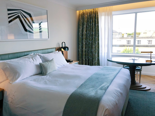 Conrad Dublin hotel review: King Premier Room television, desk area, and chaise