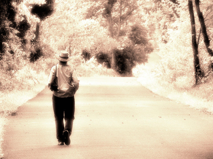 man-walking-down-road