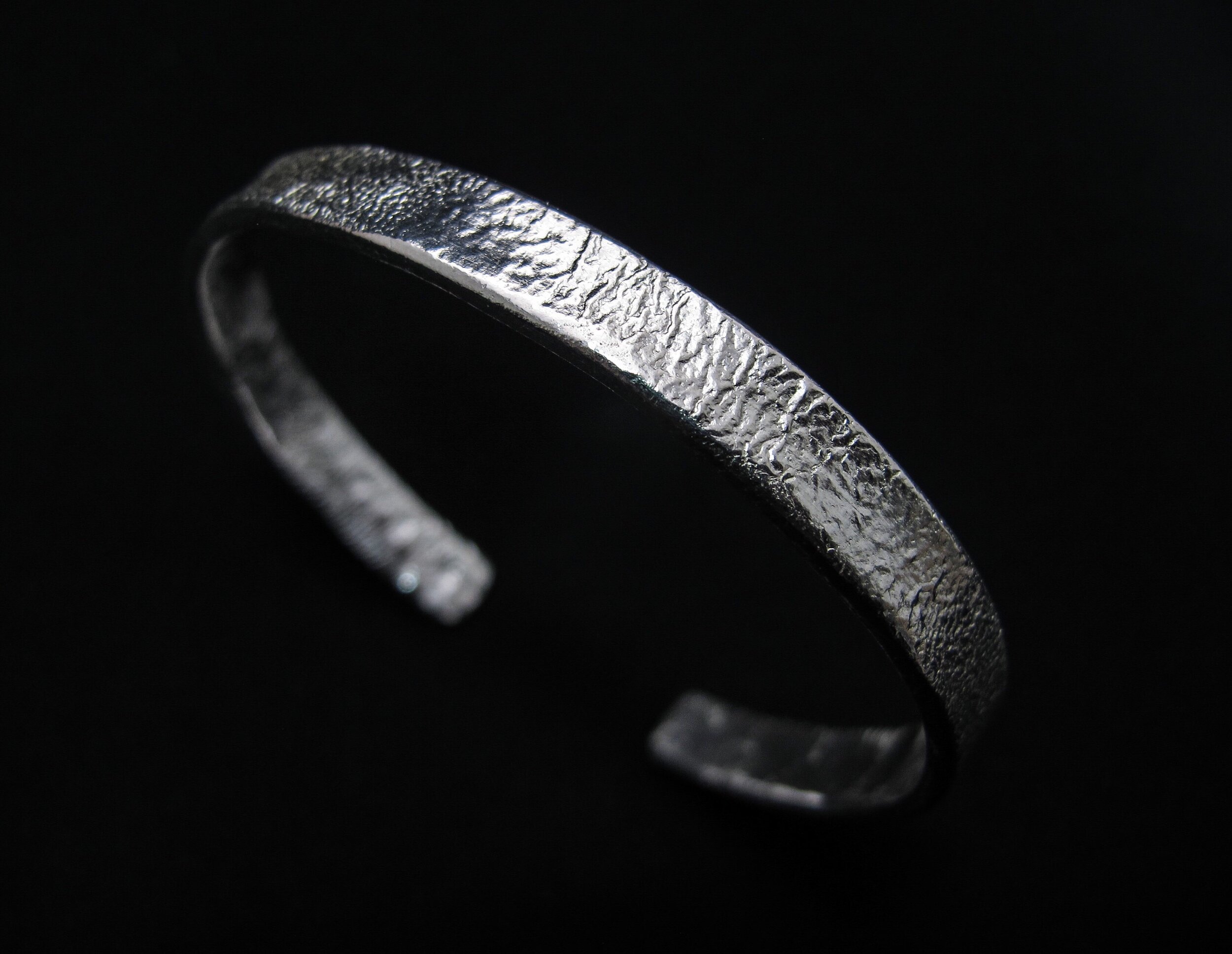 Solid silver shop torque bangle