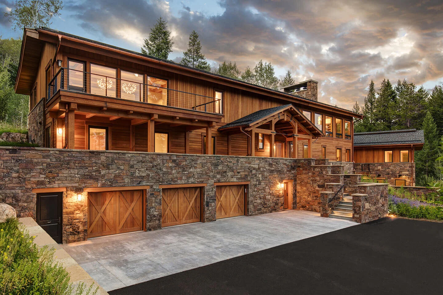 Ski lodge with wooden exterior at dusk