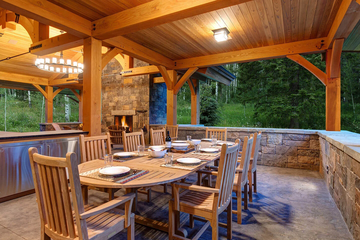 Outdoors dining area with stone wall