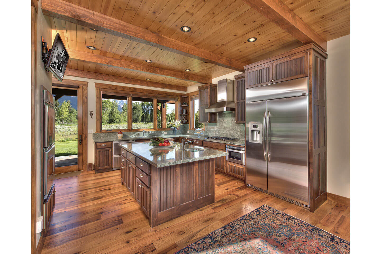 Spacious kitchen with wooden floor and ceiling

