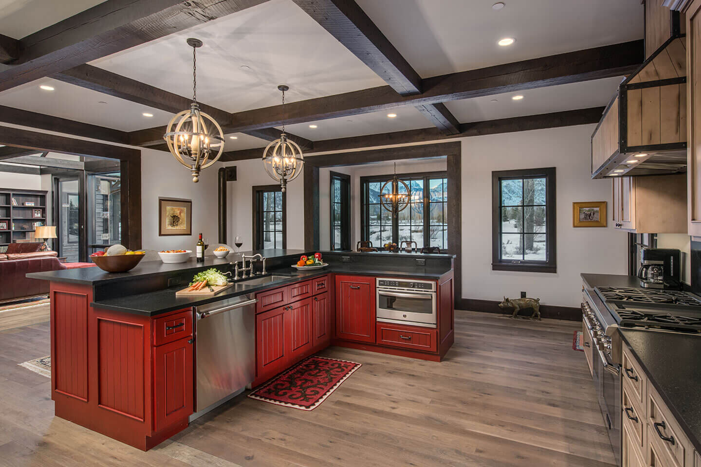 Kitchen with red center island and scrubbed oak flooring