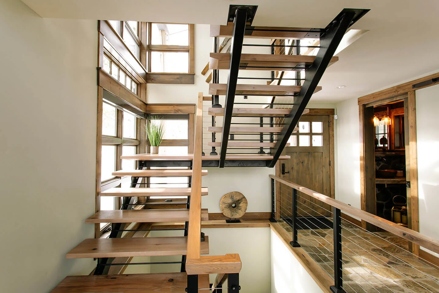 Sculptural staircase leading to loft