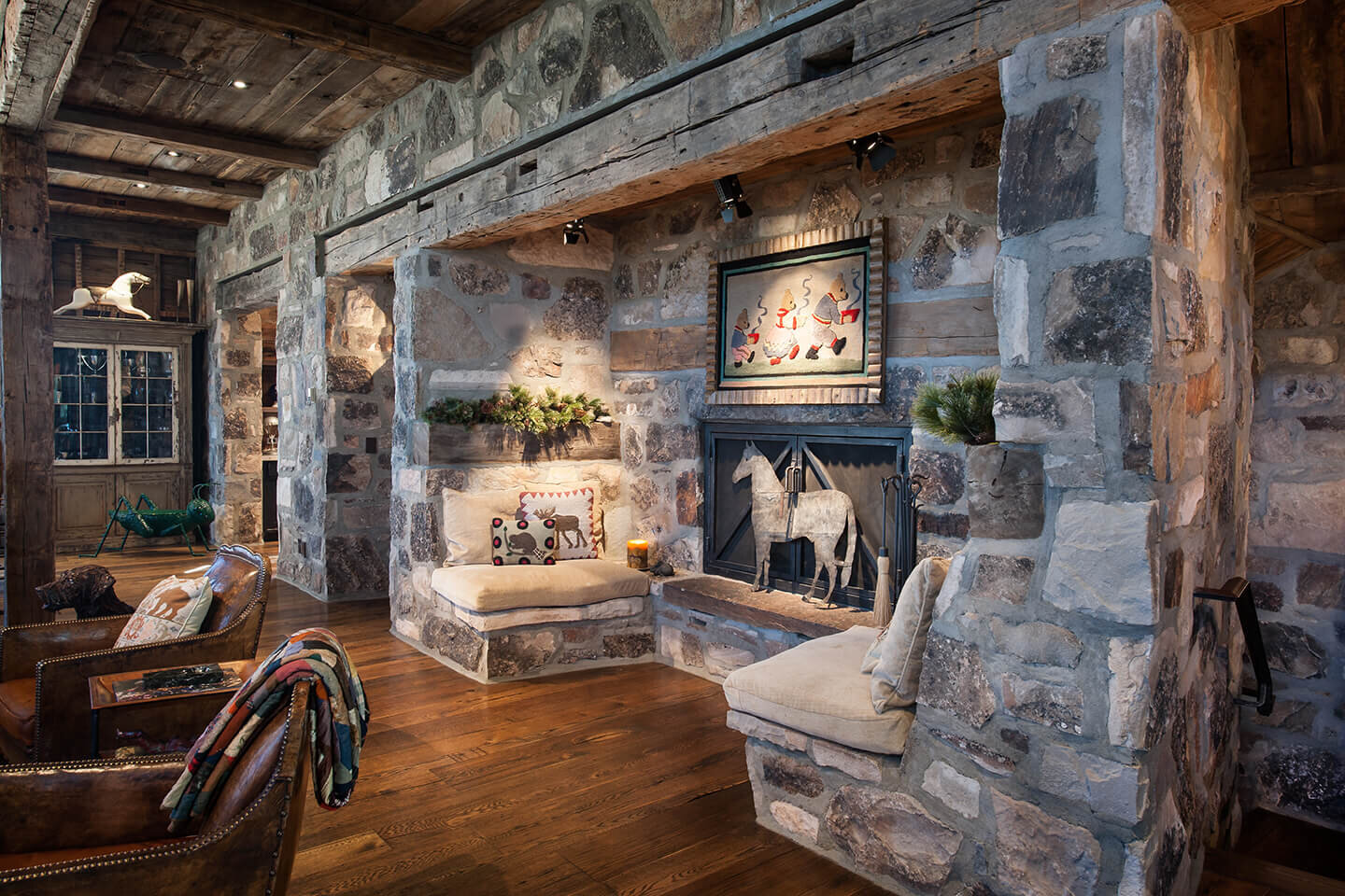 Rustic stone fireplace with sitting area