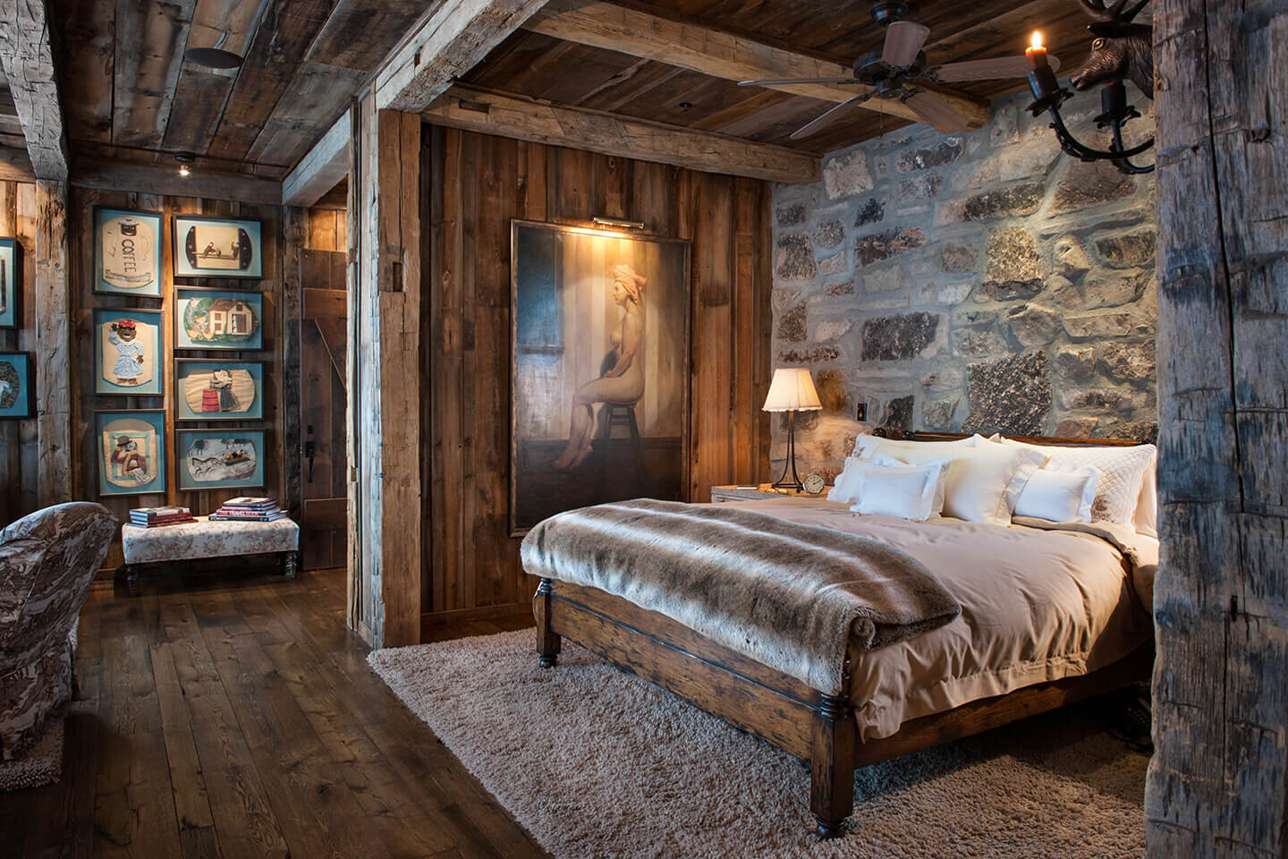 Master bedroom with wood siding and stone wall