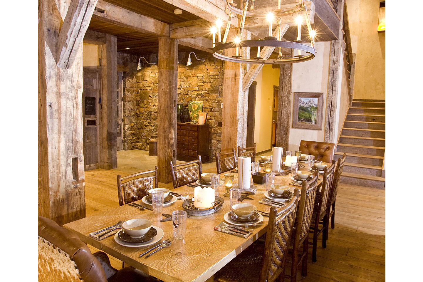 Rustic dining room with table set for festive diner