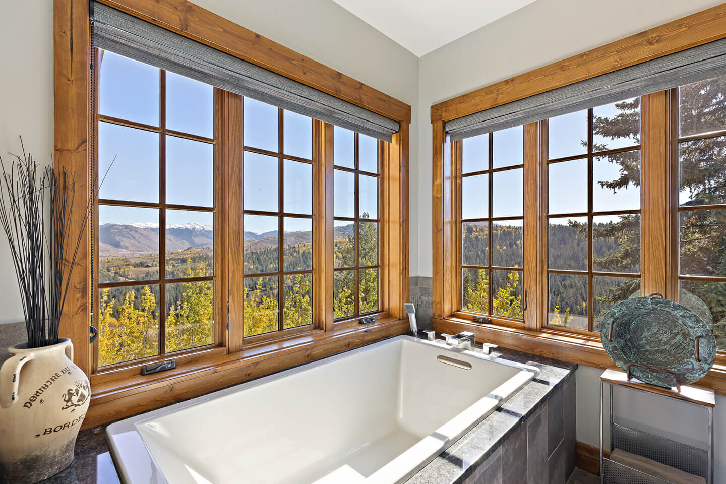 Bath tub with view downwards through French windows