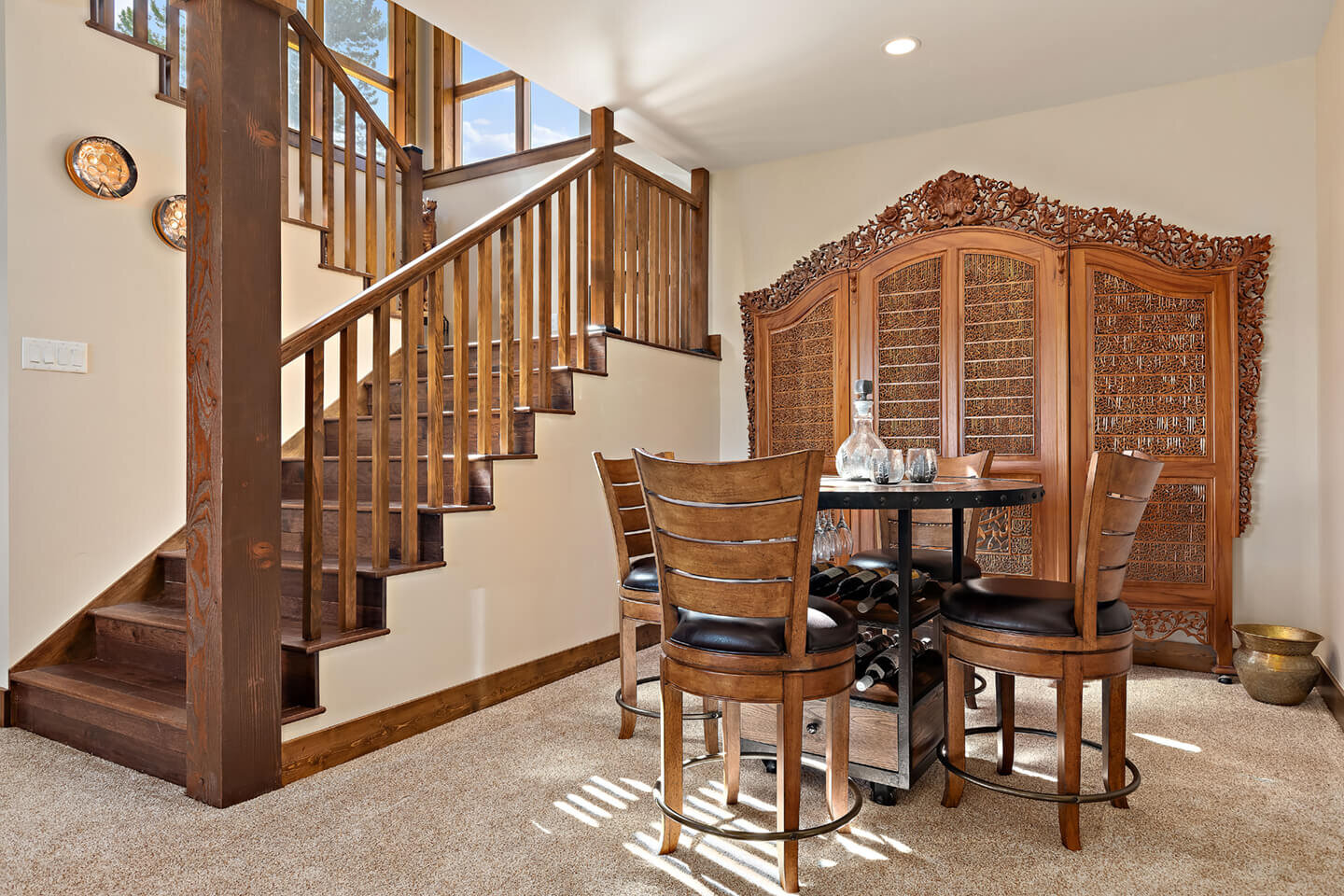 Staircase leading to basement and bar area