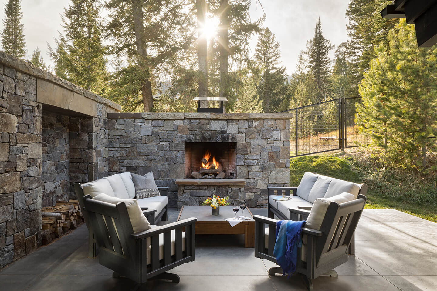 Patio with privacy wall built of native stone