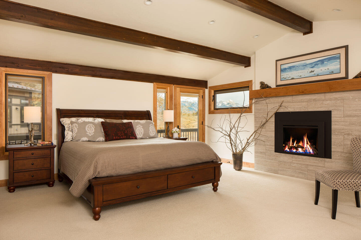 Contemporary master bedroom with enclosed fireplace