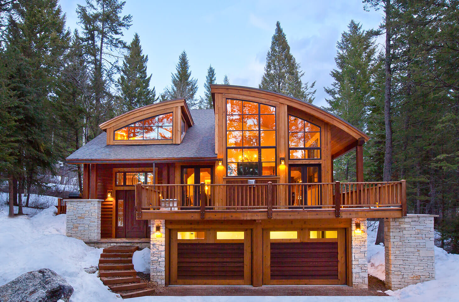 Winter ski lodge with curved roof and  large windows