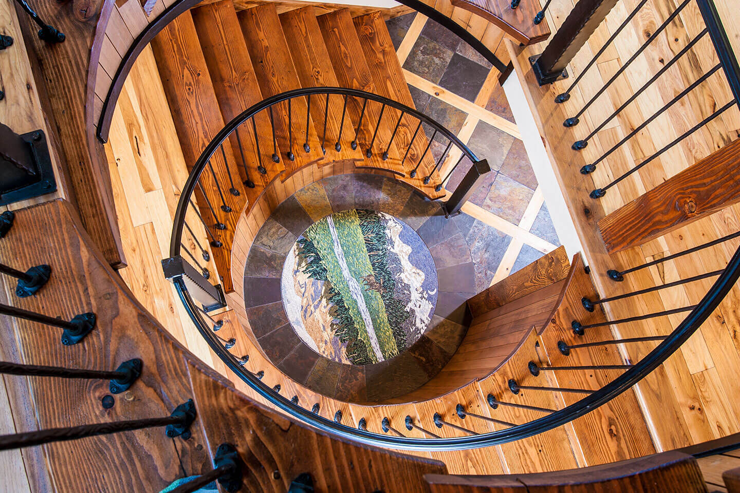 Spiral staircase with mosaic inset