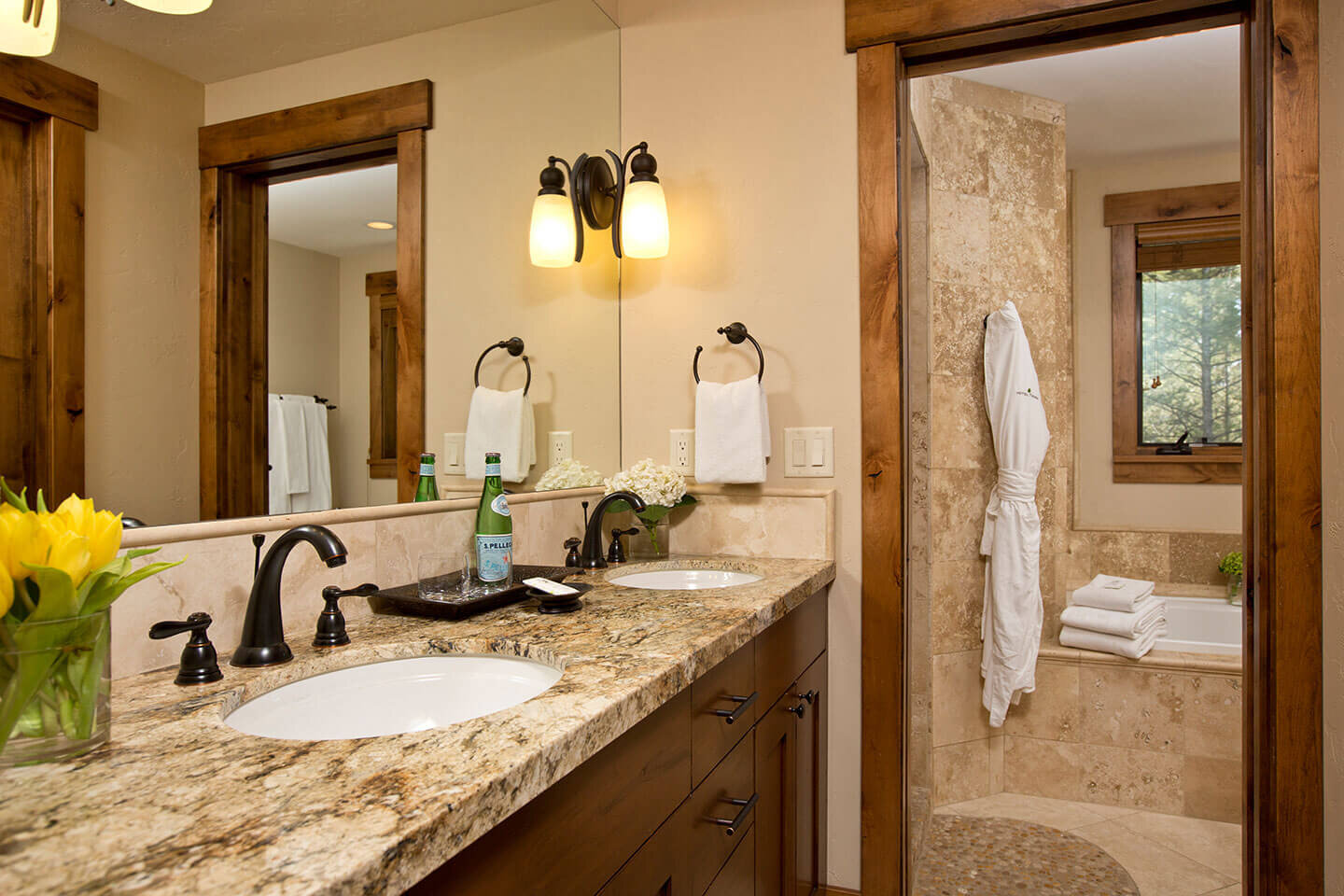 Bathroom with granite counter top and dual sinks