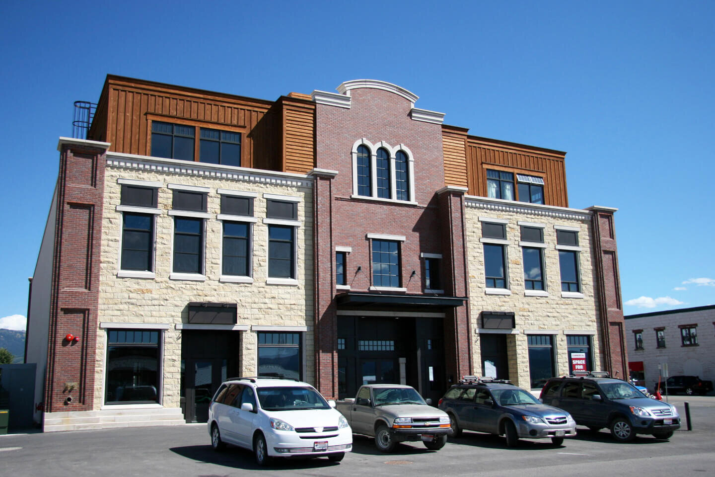 Exterior view of building with cars parked