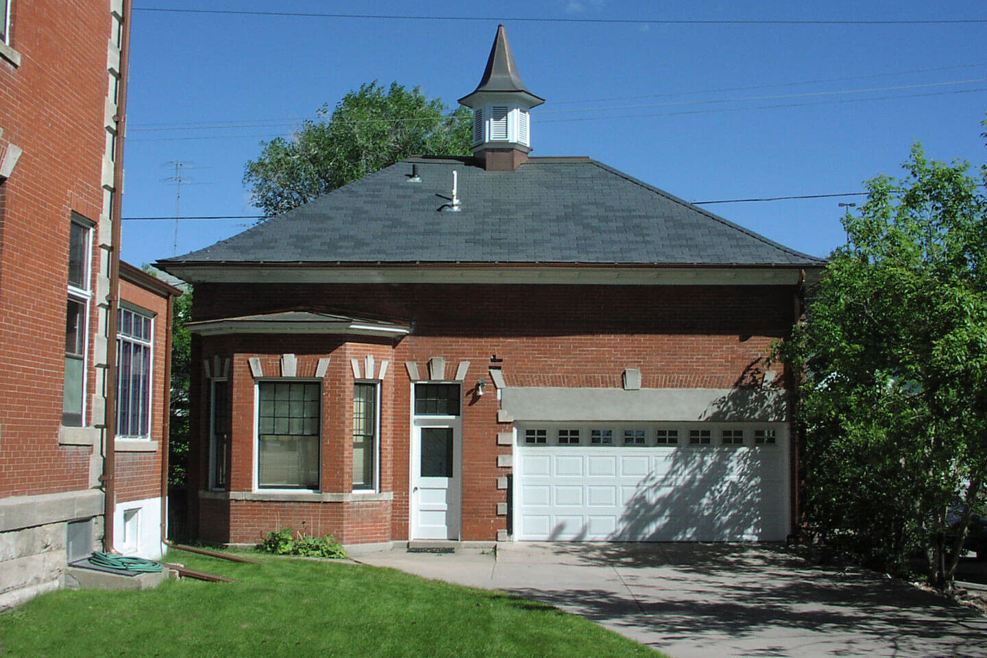 Red brick carriage house with turret