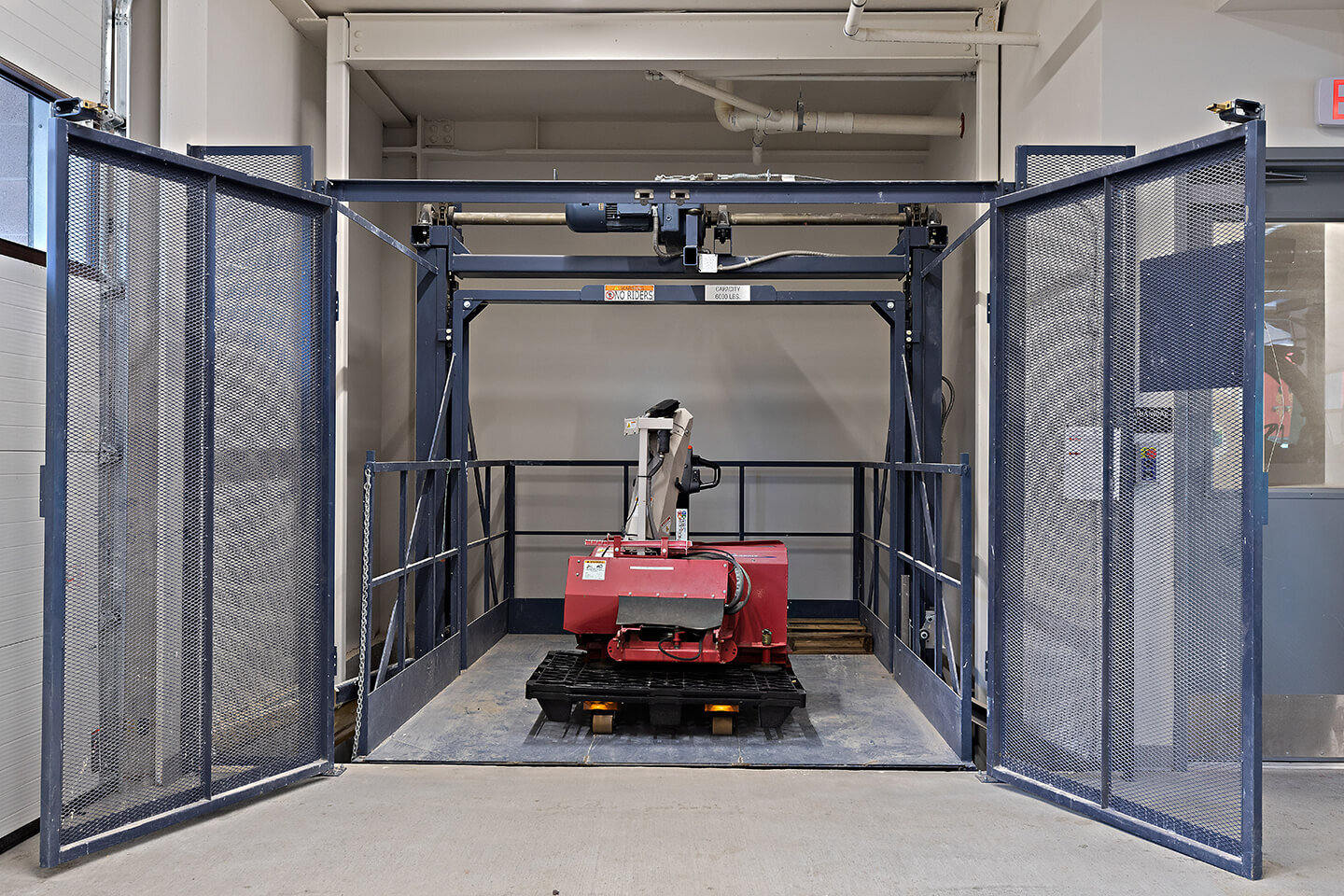 Equipment elevator with red duster