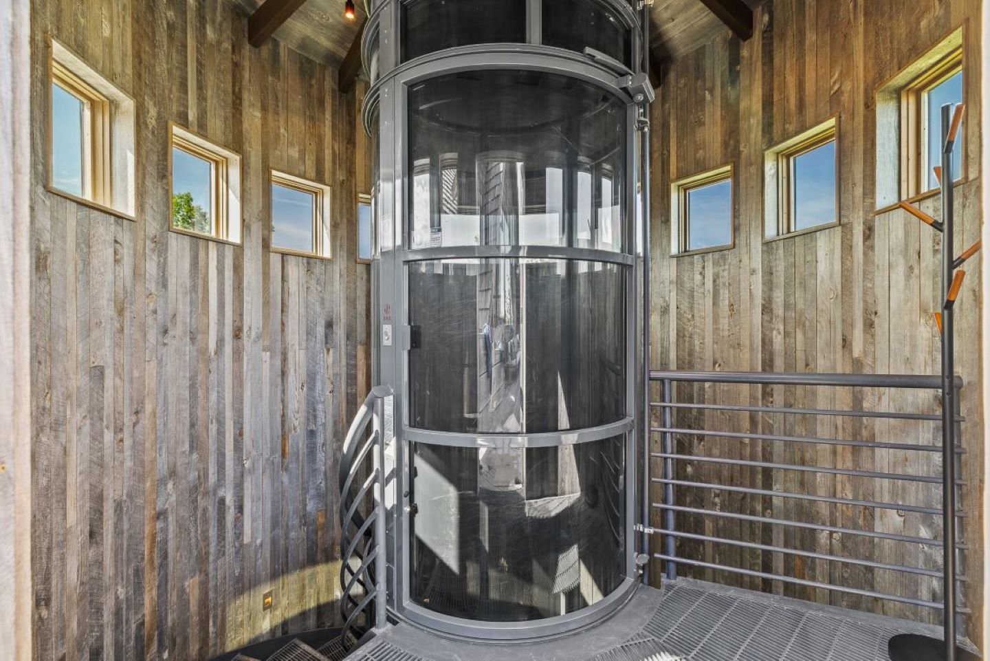 Custom elevator and spiral staircase in silo