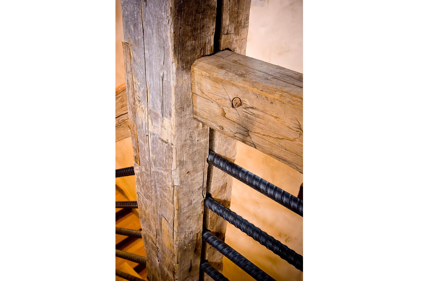 Stairway detail of square log and iron handrails