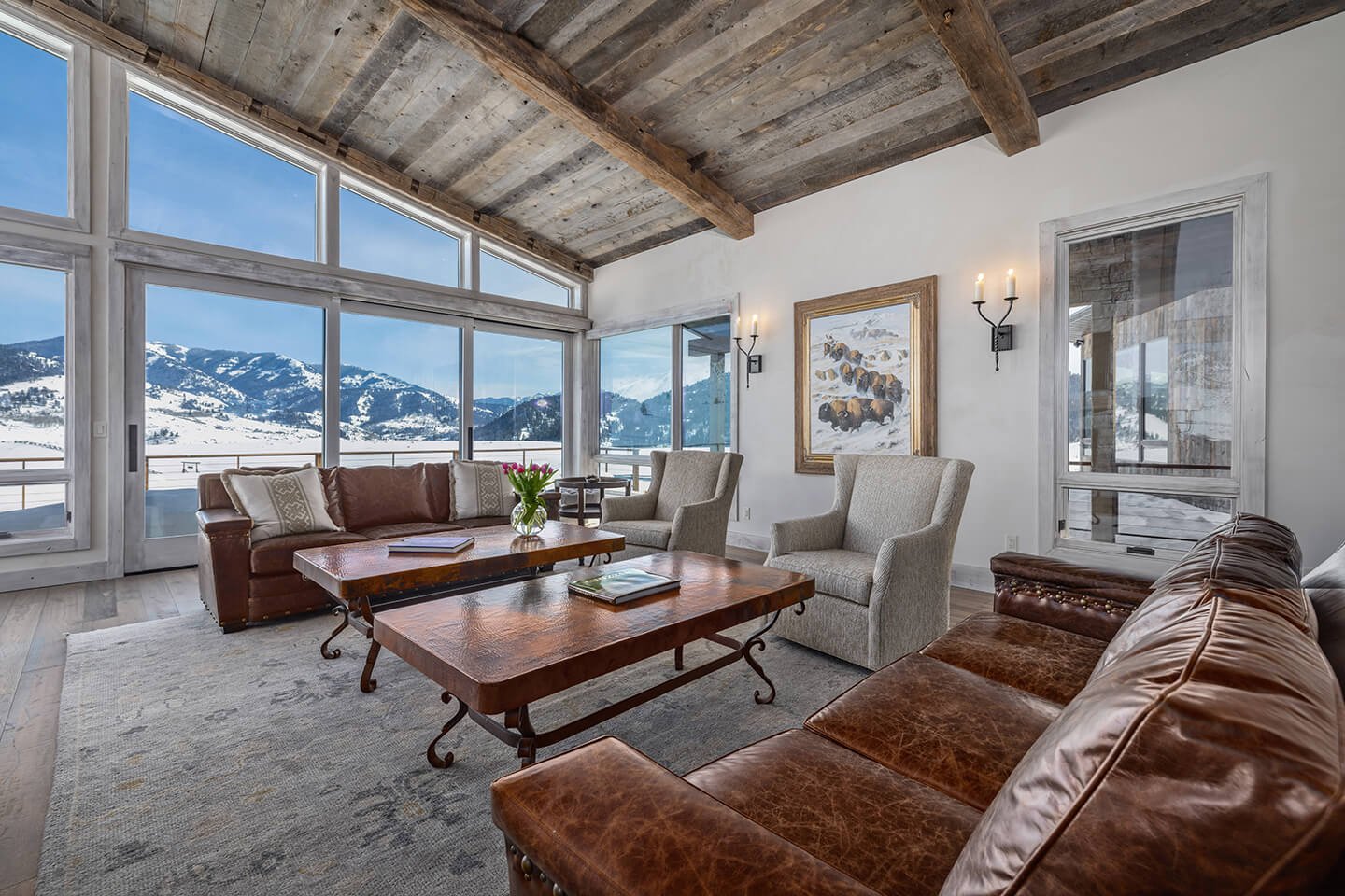 Living room with large windows and recycled timber ceiling