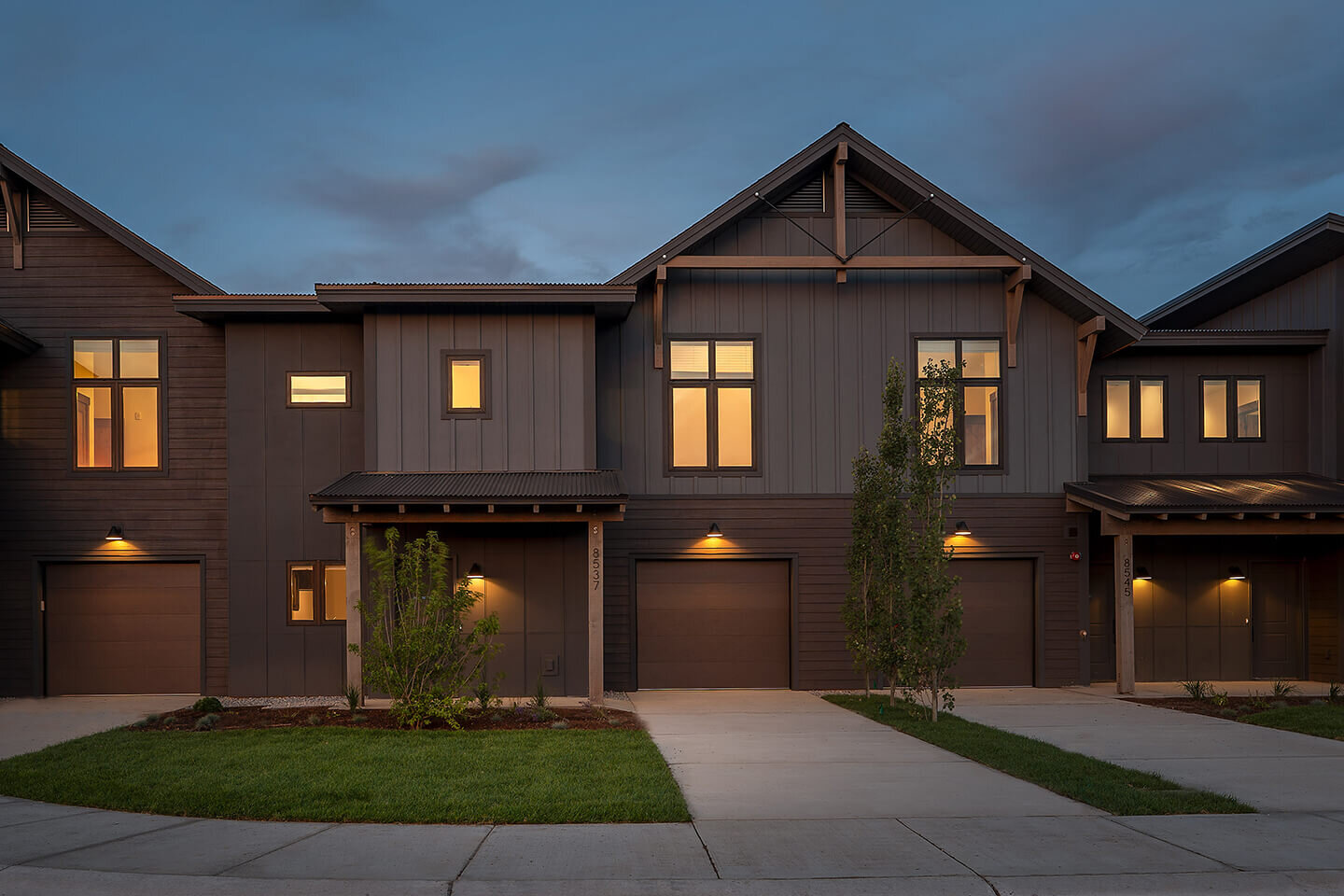 Townhouses detail with lit up windows and dark sky