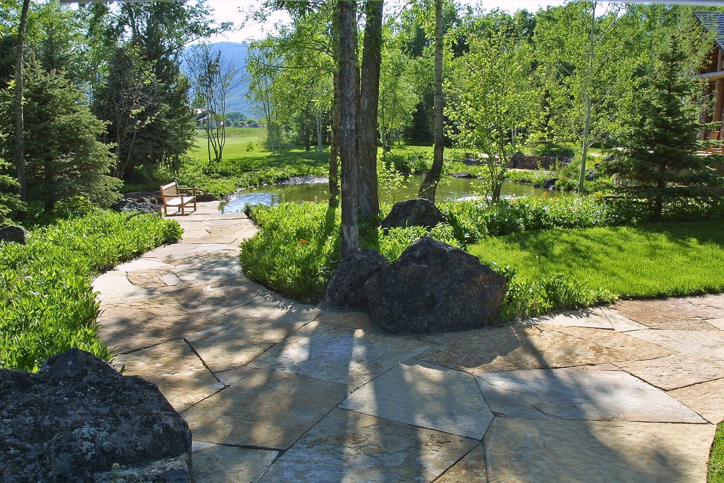 Limestone pathway leading to yard and pond