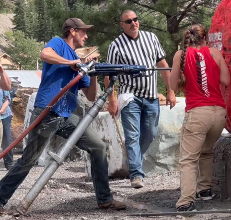 Men drilling holes into rock